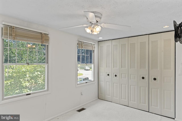 13825 Palmer House Way Unit 32-237, Silver Spring, MD 20904 - unfurnished bedroom with carpet flooring, a textured ceiling, a ceiling fan, recessed lighting, and a closet