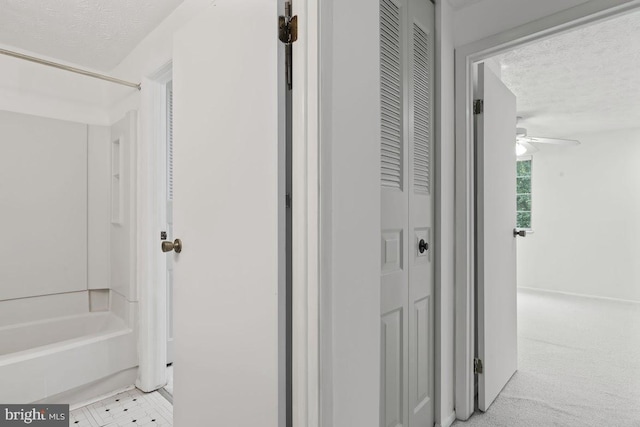 13825 Palmer House Way Unit 32-237, Silver Spring, MD 20904 - bathroom with a closet, a textured ceiling, ceiling fan, and  shower combination