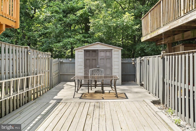 13825 Palmer House Way Unit 32-237, Silver Spring, MD 20904 - wooden deck featuring a storage shed, outdoor dining space, and a fenced backyard