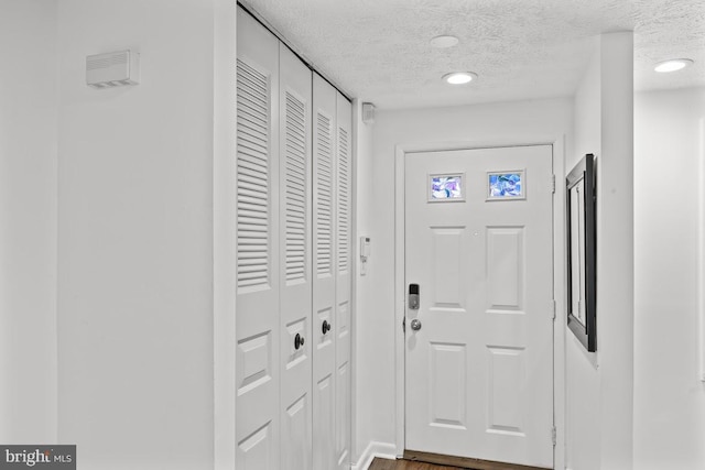 13825 Palmer House Way Unit 32-237, Silver Spring, MD 20904 - foyer entrance featuring a textured ceiling