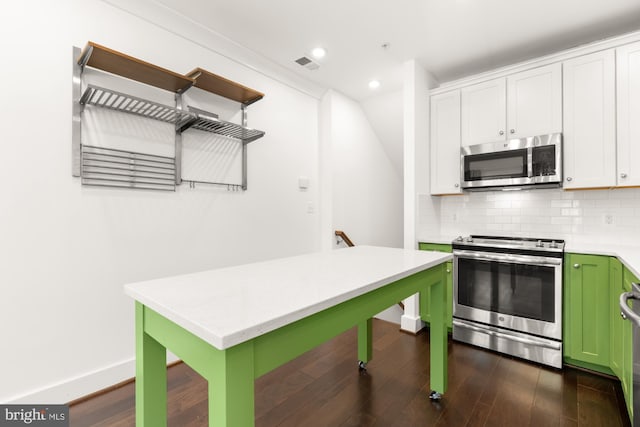 7229 Georgia Ave NW Unit A, Washington, DC 20012 - kitchen with appliances with stainless steel finishes, light countertops, green cabinets, white cabinets, and dark wood finished floors