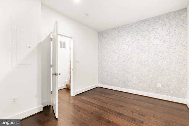 7229 Georgia Ave NW Unit A, Washington, DC 20012 - unfurnished room with electric panel, dark wood-type flooring, baseboards, wallpapered walls, and a smoke detector