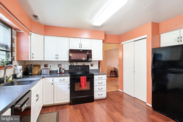 3 Prickett Ln, Hainesport, NJ 08036 - kitchen featuring black appliances, a sink, tasteful backsplash, and wood finished floors