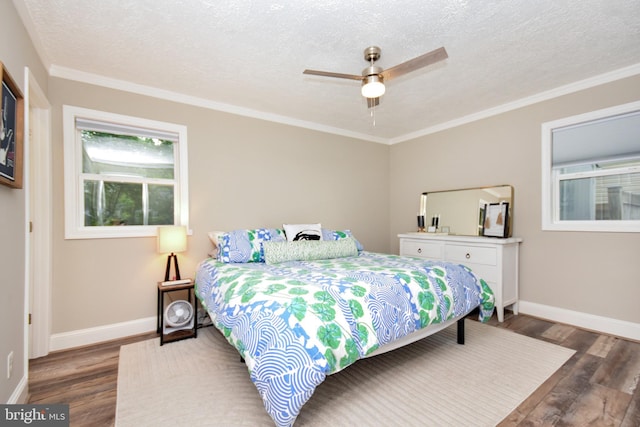 8755 Cather Ave, Manassas, VA 20110 - bedroom featuring wood finished floors, baseboards, crown molding, a textured ceiling, and ceiling fan