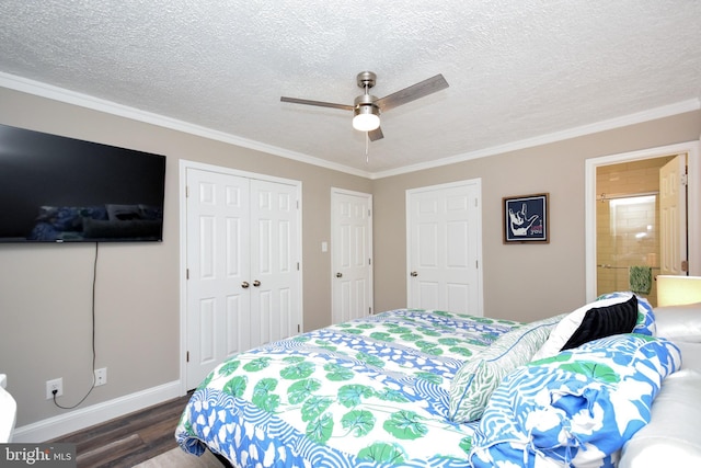 8755 Cather Ave, Manassas, VA 20110 - bedroom with dark wood-style floors, crown molding, a closet, a textured ceiling, and baseboards