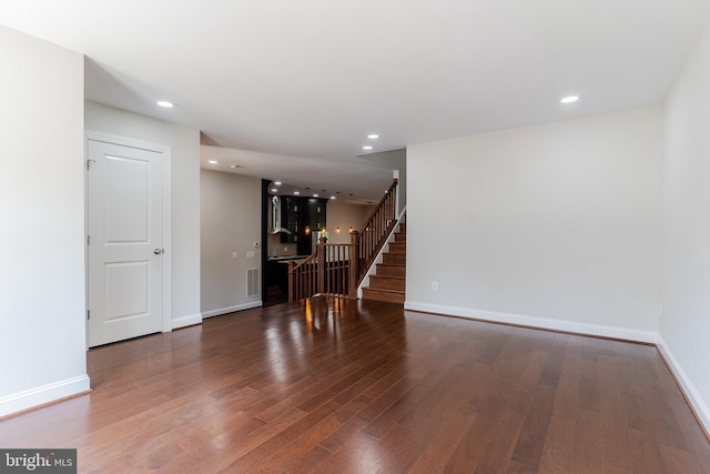 23480 Epperson Sq, Brambleton, VA 20148 - spare room with stairway, wood finished floors, baseboards, and recessed lighting
