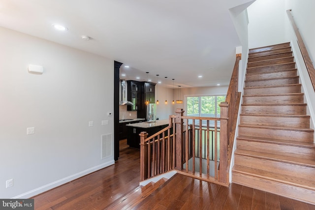 23480 Epperson Sq, Brambleton, VA 20148 - stairway with wood finished floors, recessed lighting, and baseboards