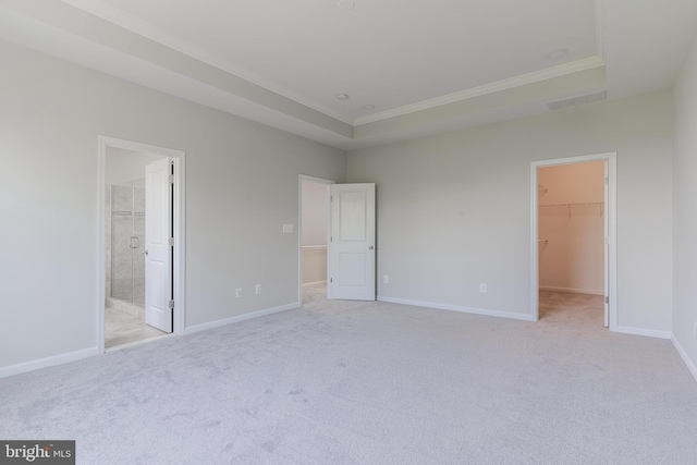 23480 Epperson Sq, Brambleton, VA 20148 - unfurnished bedroom with a walk in closet, crown molding, light colored carpet, a closet, and baseboards