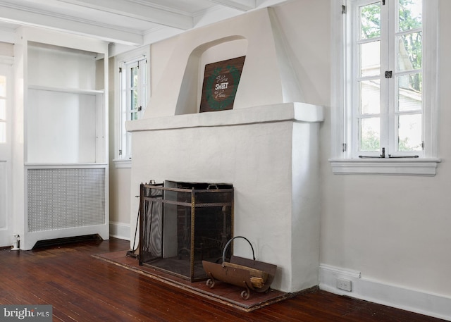 908 Edge Hill Rd, Glenside, PA 19038 - unfurnished living room with hardwood / wood-style flooring, a fireplace, beamed ceiling, ornamental molding, and plenty of natural light