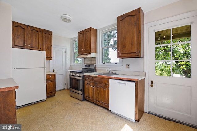 908 Edge Hill Rd, Glenside, PA 19038 - kitchen with white appliances, a sink, light countertops, under cabinet range hood, and light flooring