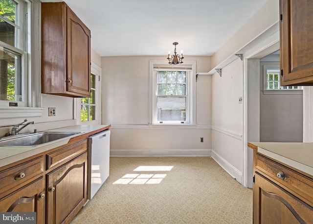 908 Edge Hill Rd, Glenside, PA 19038 - kitchen featuring a sink, dishwasher, a chandelier, light countertops, and light colored carpet