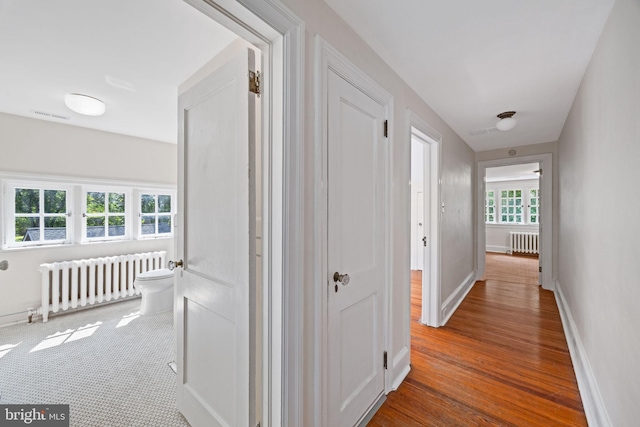 908 Edge Hill Rd, Glenside, PA 19038 - hall with radiator heating unit, wood finished floors, and baseboards