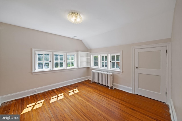 908 Edge Hill Rd, Glenside, PA 19038 - bonus room featuring radiator, baseboards, lofted ceiling, and wood-type flooring