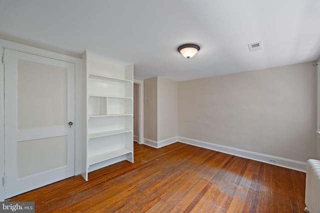 908 Edge Hill Rd, Glenside, PA 19038 - unfurnished bedroom featuring baseboards, hardwood / wood-style flooring, and radiator heating unit