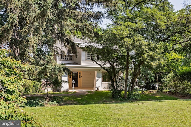 908 Edge Hill Rd, Glenside, PA 19038 - view of property hidden behind natural elements with a front lawn and a porch