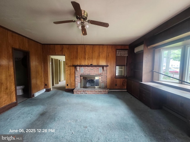 139 W Walnut St, North Wales, PA 19454 - unfurnished living room with wood walls, a wall unit AC, a ceiling fan, a fireplace, and carpet floors