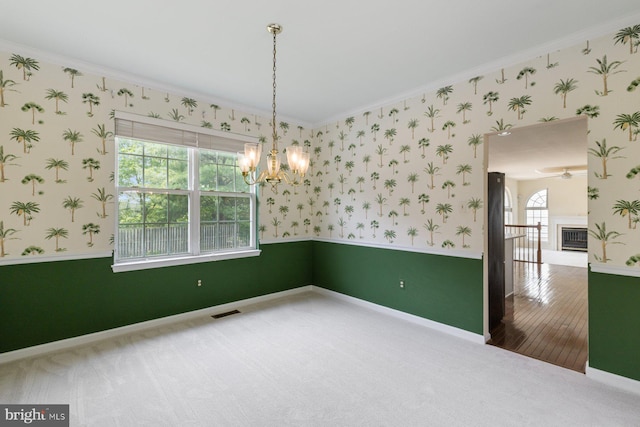 5915 Clear Ridge Rd, Elkridge, MD 21075 - carpeted empty room featuring wallpapered walls, ornamental molding, a chandelier, and baseboards