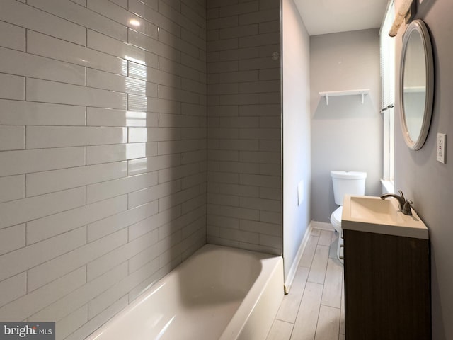 5319 Osage Ave, Philadelphia, PA 19143 - bathroom with vanity, toilet, baseboards, and washtub / shower combination