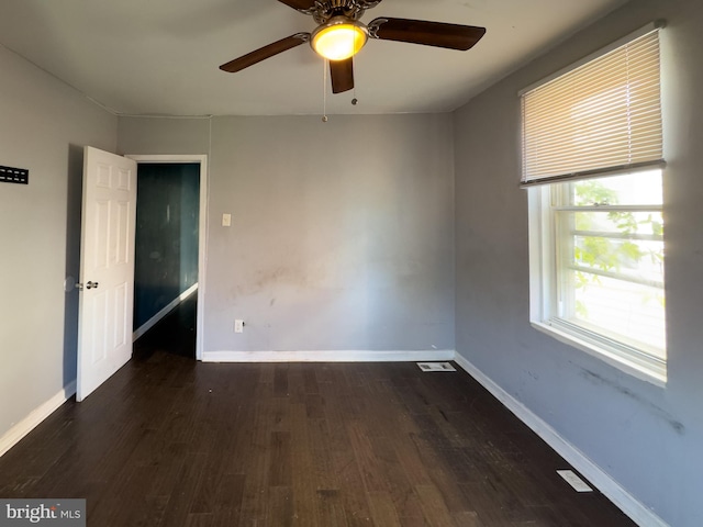 5319 Osage Ave, Philadelphia, PA 19143 - spare room with dark wood-style flooring, a ceiling fan, and baseboards