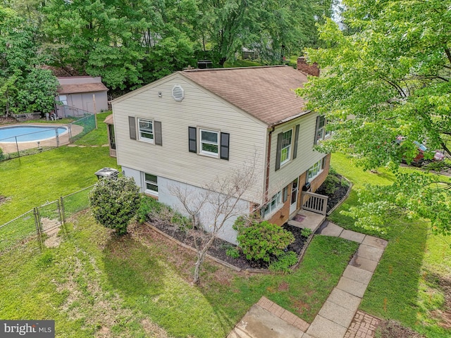 14332 Ferndale Rd, Woodbridge, VA 22193 - view of home's exterior with a chimney and a gate