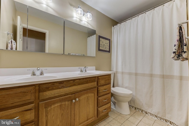 3130 Ashwood Dr, Dunkirk, MD 20754 - bathroom with tile patterned flooring, double vanity, toilet, and a shower with shower curtain