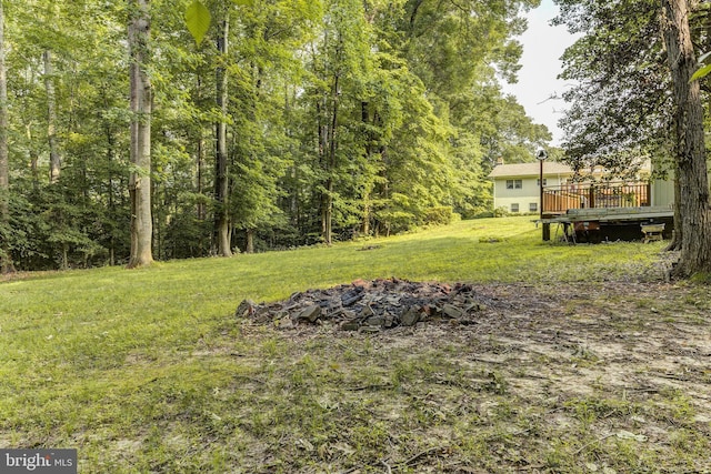 3130 Ashwood Dr, Dunkirk, MD 20754 - view of green lawn featuring a deck and a wooded view