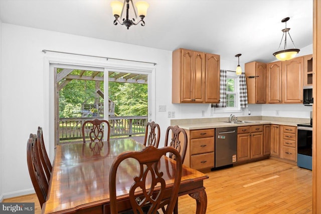835 Campers Ln, Ruther Glen, VA 22546 - kitchen with appliances with stainless steel finishes, light wood-style floors, light countertops, and decorative light fixtures