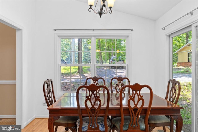 835 Campers Ln, Ruther Glen, VA 22546 - dining area featuring a chandelier, vaulted ceiling, light wood-style floors, and baseboards