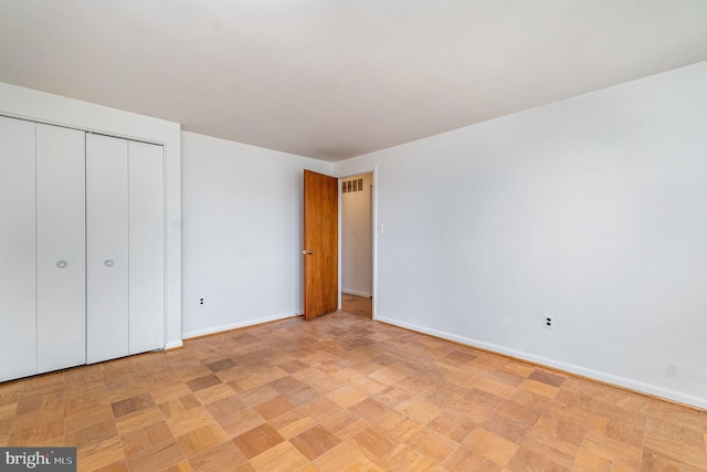 934 Circle Dr, Baltimore, MD 21227 - unfurnished bedroom featuring baseboards and a closet