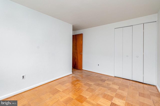 934 Circle Dr, Baltimore, MD 21227 - unfurnished bedroom featuring baseboards and a closet