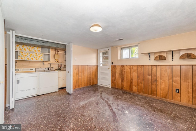 934 Circle Dr, Baltimore, MD 21227 - basement featuring independent washer and dryer, a wainscoted wall, and wooden walls