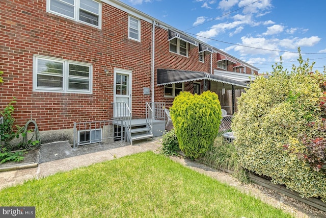 934 Circle Dr, Baltimore, MD 21227 - rear view of property featuring brick siding