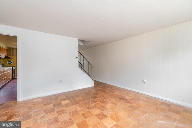 934 Circle Dr, Baltimore, MD 21227 - unfurnished room featuring stairway and baseboards
