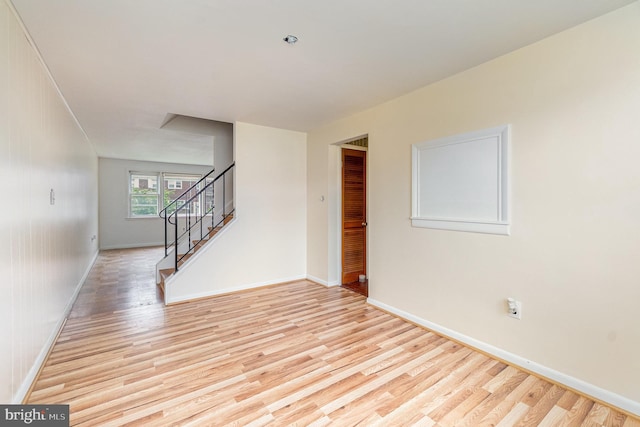 934 Circle Dr, Baltimore, MD 21227 - spare room featuring light wood-style floors, stairway, and baseboards