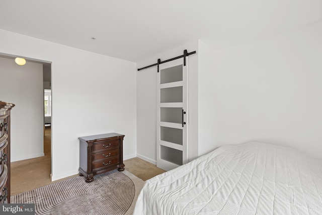 14842 Mason Creek Cir, Woodbridge, VA 22191 - bedroom featuring carpet, a barn door, and baseboards