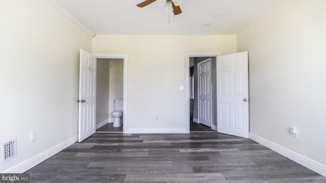 2513 Christian St, Baltimore, MD 21223 - unfurnished bedroom with dark wood-style floors, baseboards, ensuite bath, and ceiling fan