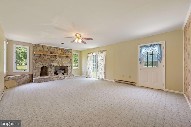 2814 Killens Pond Rd, Harrington, DE 19952 - unfurnished living room featuring baseboard heating, plenty of natural light, and baseboards