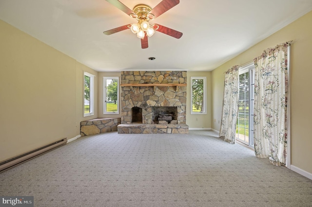 2814 Killens Pond Rd, Harrington, DE 19952 - unfurnished living room with baseboards, carpet flooring, a baseboard heating unit, a fireplace, and ceiling fan
