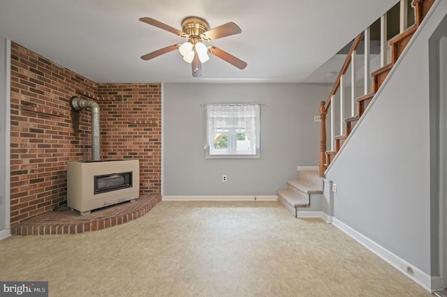2814 Killens Pond Rd, Harrington, DE 19952 - unfurnished living room with stairway, ceiling fan, a wood stove, tile patterned floors, and baseboards