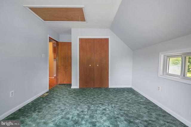 2814 Killens Pond Rd, Harrington, DE 19952 - unfurnished bedroom featuring attic access, vaulted ceiling, baseboards, carpet floors, and a closet