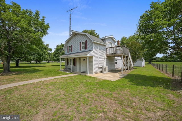 2814 Killens Pond Rd, Harrington, DE 19952 - view of front of house with a deck, a gambrel roof, ac unit, a patio, and stairs