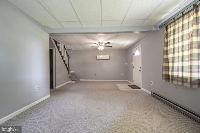 2814 Killens Pond Rd, Harrington, DE 19952 - carpeted entryway with a baseboard radiator, a wall mounted air conditioner, stairs, baseboards, and a paneled ceiling