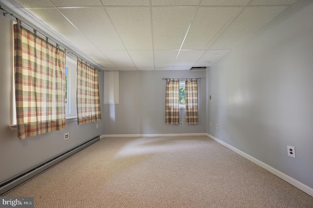 2814 Killens Pond Rd, Harrington, DE 19952 - spare room featuring a paneled ceiling, carpet floors, a baseboard radiator, and baseboards