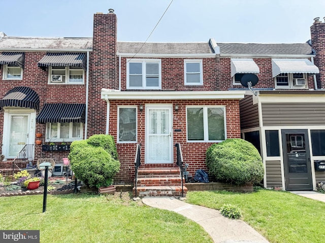 2714 N Pine St, Wilmington, DE 19802 - multi unit property with entry steps, a chimney, and brick siding