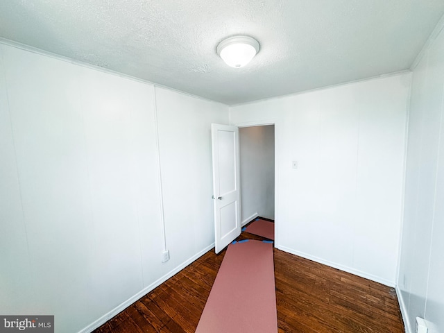 2714 N Pine St, Wilmington, DE 19802 - spare room featuring dark wood-style floors and a textured ceiling