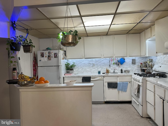 7525 Calvert St, Philadelphia, PA 19152 - kitchen featuring white appliances, light countertops, white cabinets, decorative backsplash, and a drop ceiling
