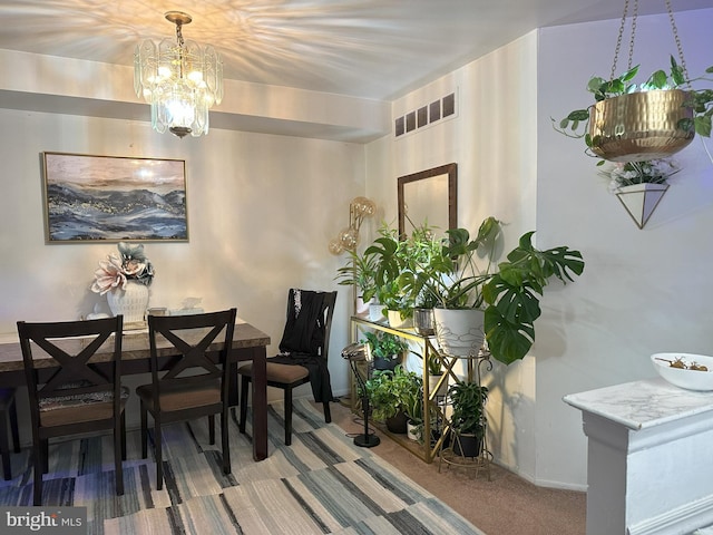 7525 Calvert St, Philadelphia, PA 19152 - dining room with a chandelier, carpet flooring, and baseboards