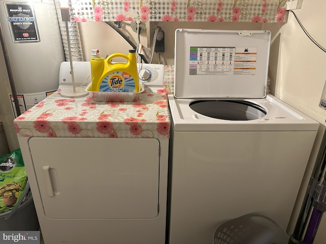 7525 Calvert St, Philadelphia, PA 19152 - laundry area with washing machine and dryer and water heater