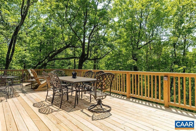 32 Stony Cove Ln, Wintergreen Resort, VA 22967 - deck with outdoor dining space and view of wooded area