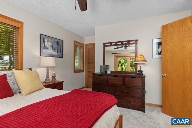 32 Stony Cove Ln, Wintergreen Resort, VA 22967 - bedroom featuring light carpet, a textured ceiling, baseboards, and a ceiling fan